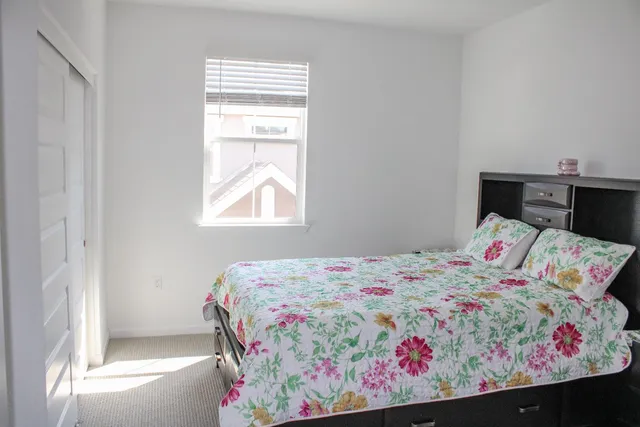 a view of room with cabinet and a flat screen tv