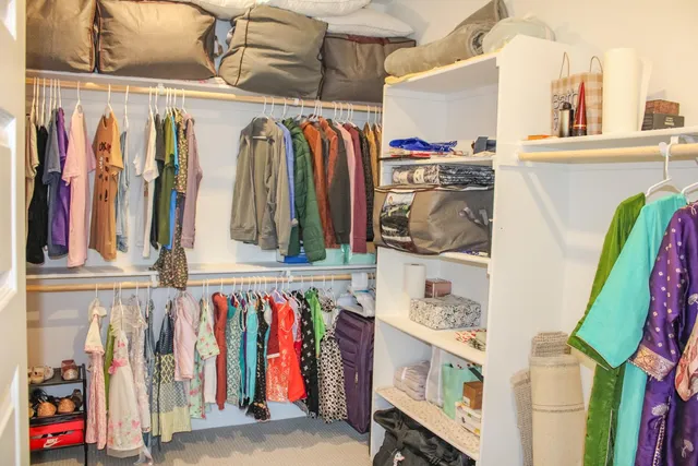 a bathroom with a granite countertop shower and a mirror