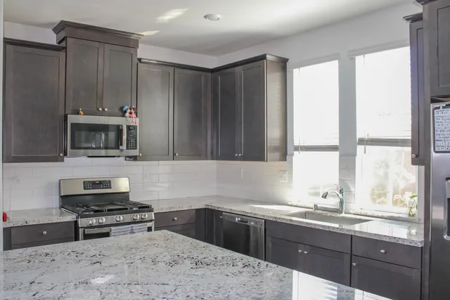 a view of a livingroom with furniture and hardwood floor