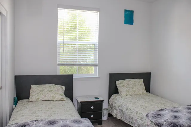 a bedroom with a bed and a couch