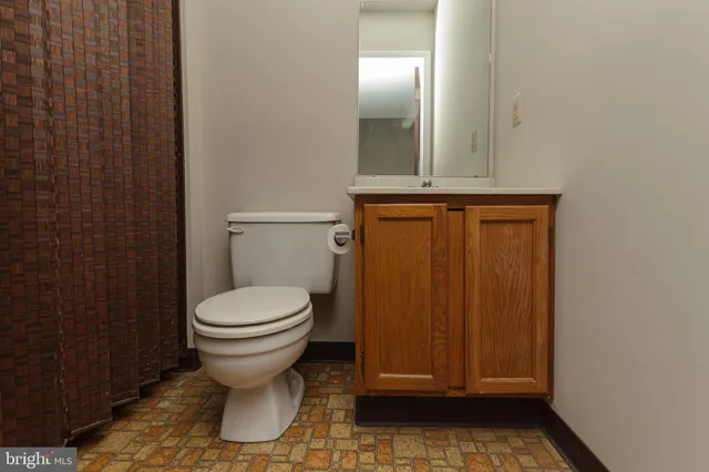 a bathroom with a toilet and a sink