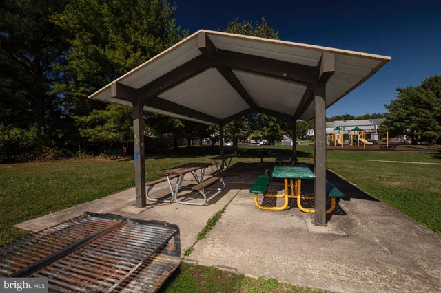a view of a wooden deck with a yard