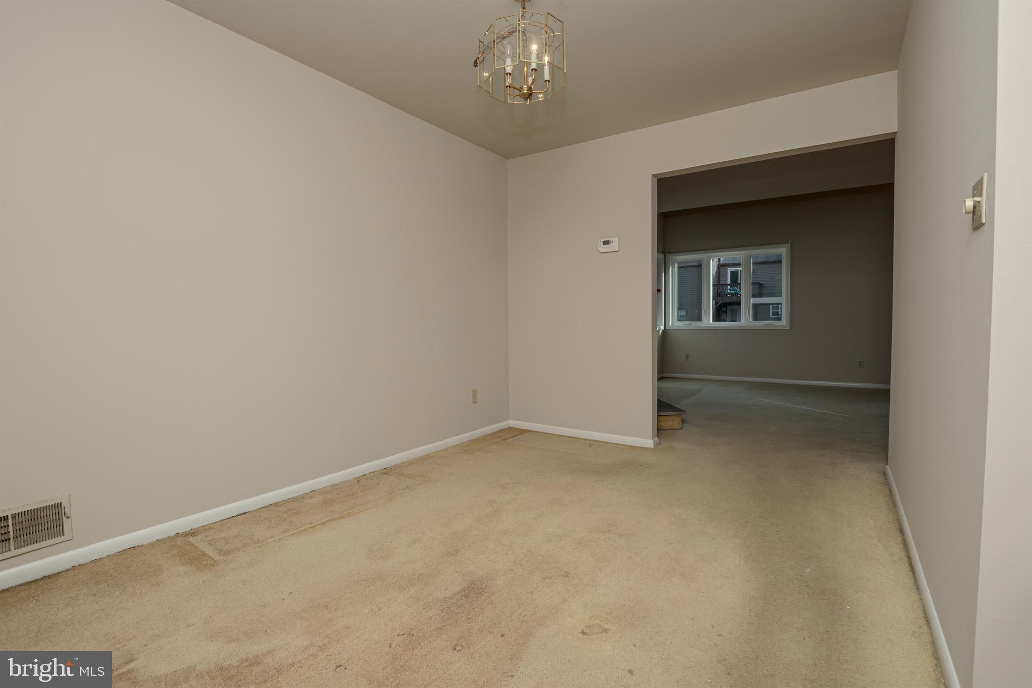 59 Valley Circle Newark, DE 19711 - Photo 10 of 23 an empty room with chandelier fan