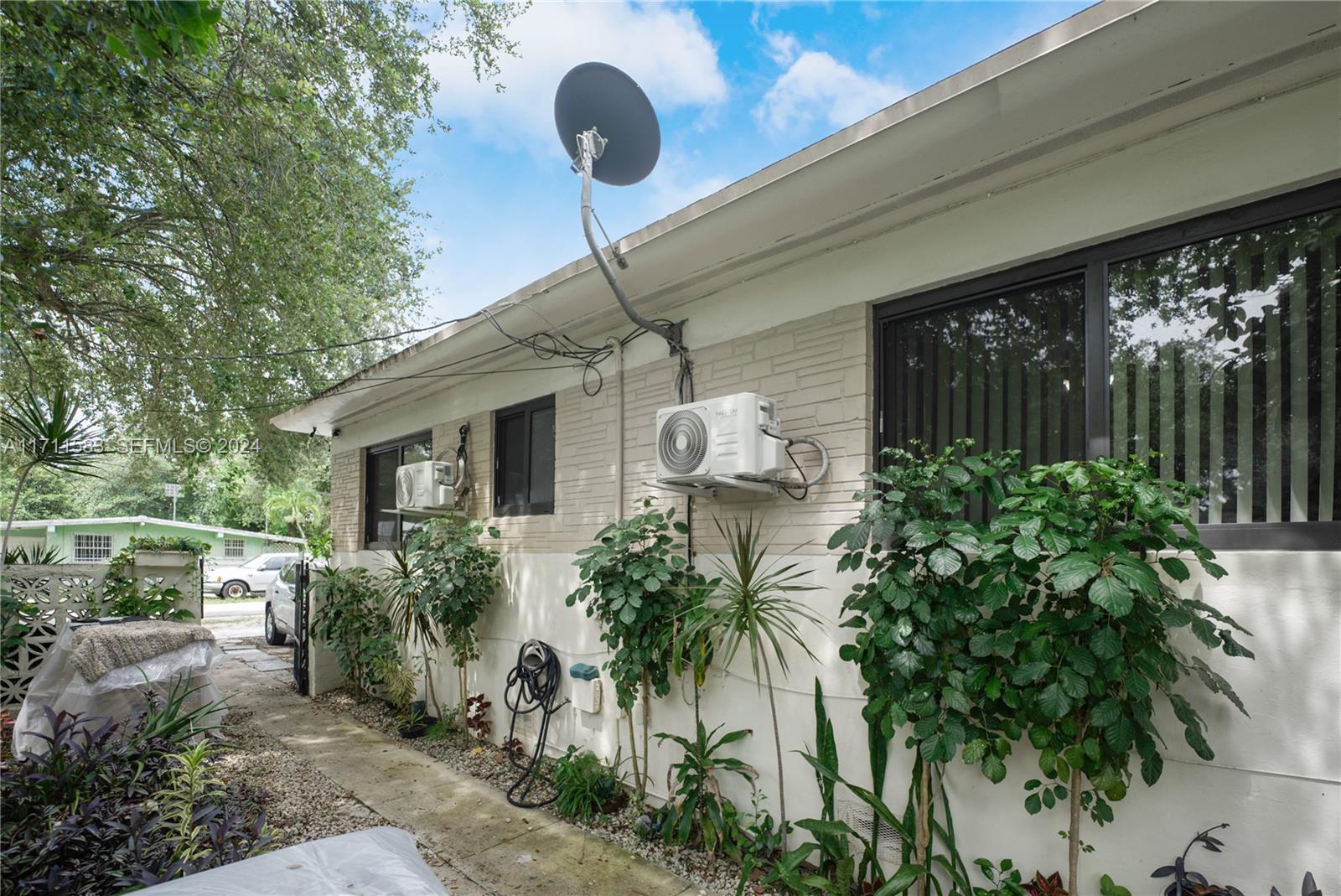 175 Northwest 68th Street Miami, FL 33150 - Photo 21 of 31 a front view of a house with garden