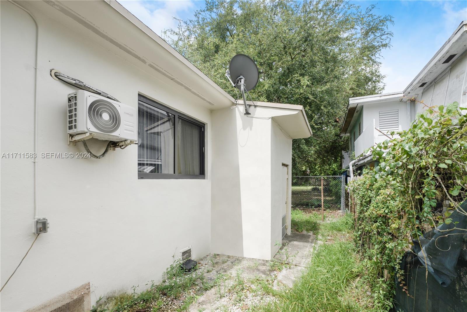 175 Northwest 68th Street Miami, FL 33150 - Photo 25 of 31 a view of a door in the backyard