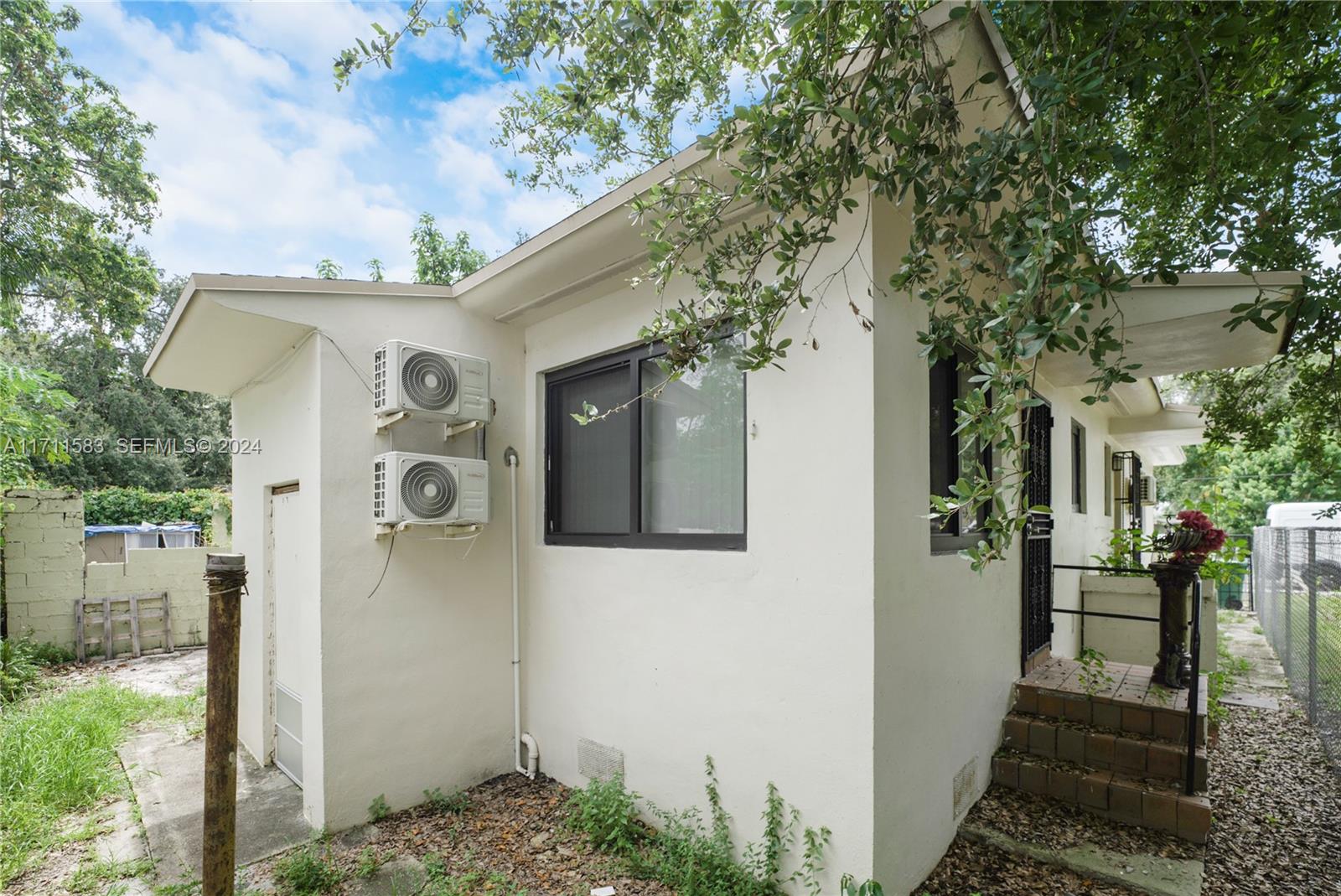 175 Northwest 68th Street Miami, FL 33150 - Photo 27 of 31 a view of a house with a tree