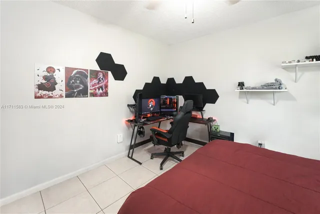 a bedroom with a bed and a chair