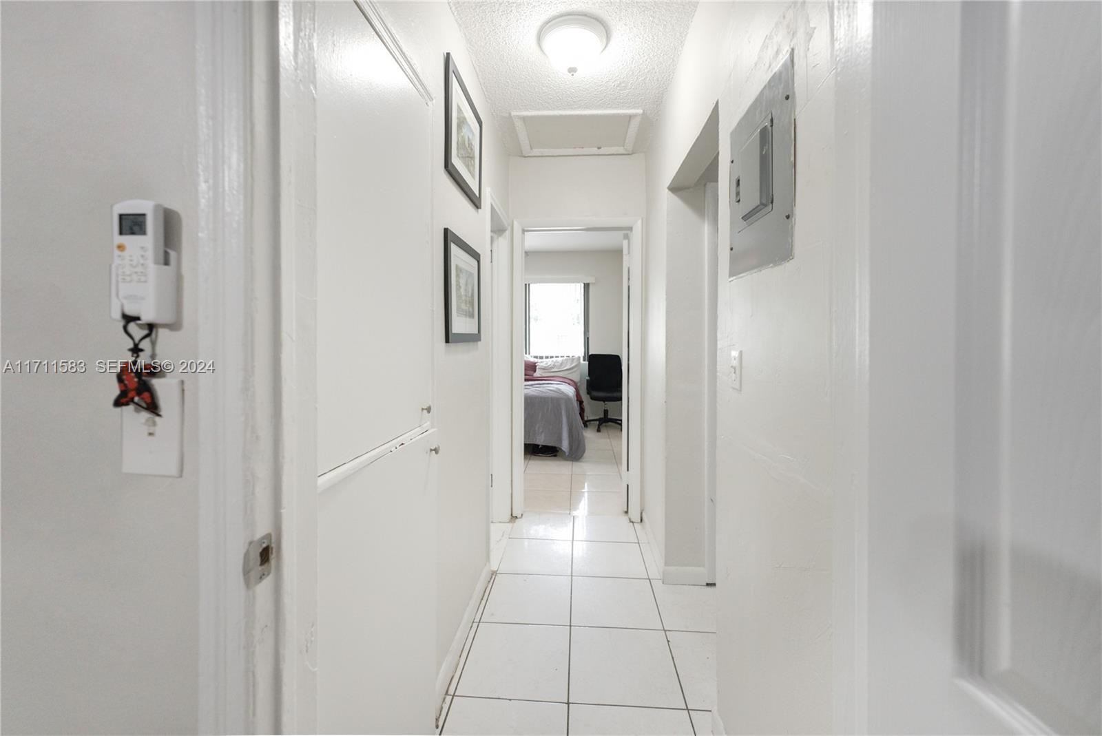 175 Northwest 68th Street Miami, FL 33150 - Photo 8 of 31 a view of a hallway with wooden floor
