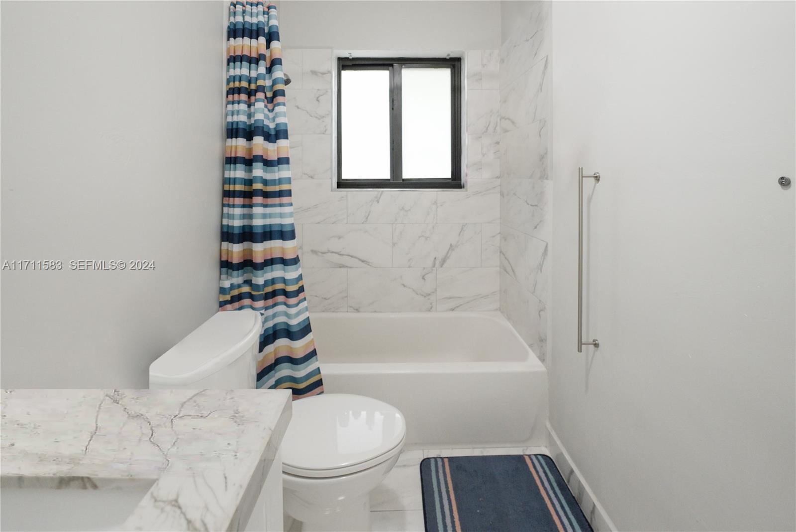 175 Northwest 68th Street Miami, FL 33150 - Photo 10 of 31 a bathroom with a sink toilet and shower