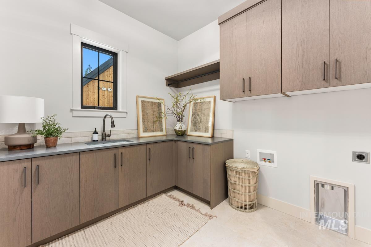 68 Ponderosa Ridge Donnelly, ID 83615 - Photo 14 of 29 Laundry area with cabinet space, washer hookup, and electric dryer hookup