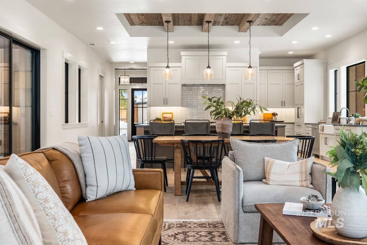 68 Ponderosa Ridge Donnelly, ID 83615 - Photo 20 of 29 Living room featuring light wood-style flooring, a raised ceiling, and recessed lighting