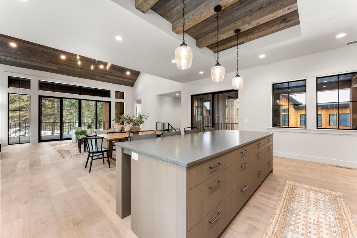 68 Ponderosa Ridge Donnelly, ID 83615 - Photo 25 of 29 Kitchen featuring wooden ceiling, light wood-style floors, modern cabinets, a large island, and healthy amount of natural light