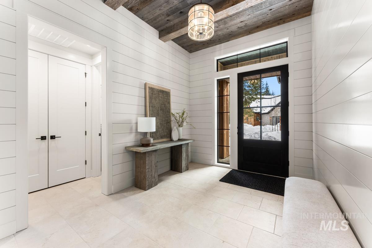 68 Ponderosa Ridge Donnelly, ID 83615 - Photo 9 of 29 Entrance foyer with a wooden ceiling with exposed beams and wood walls