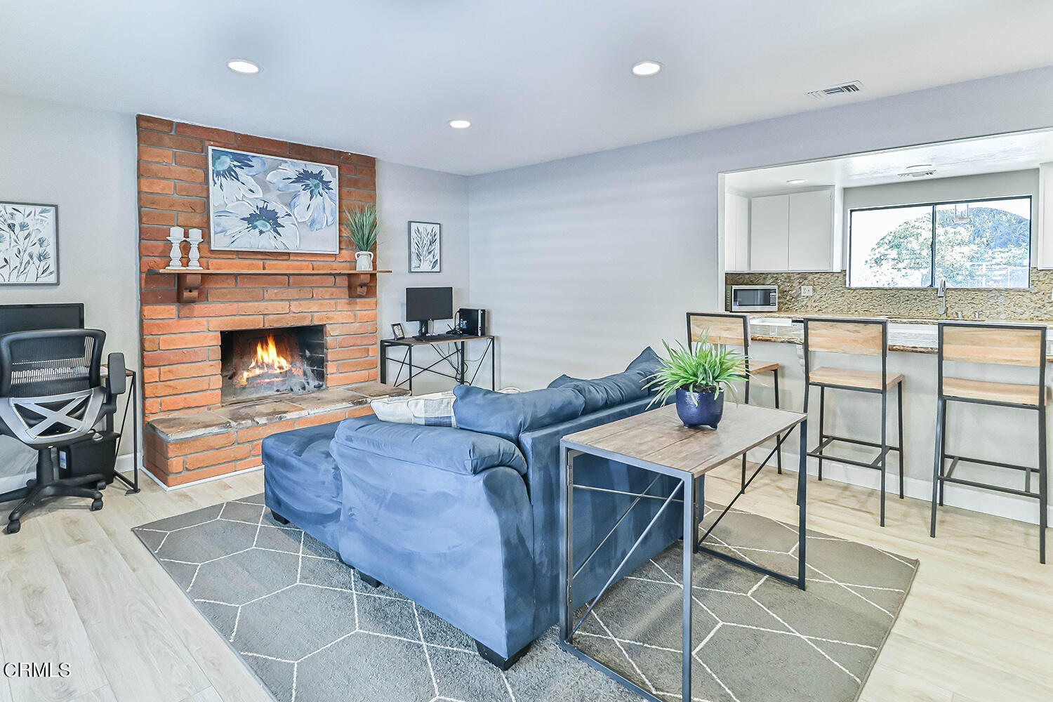 4030 Donlon Road Somis, CA 93066 - Photo 14 of 48 a living room with furniture a table and a fireplace