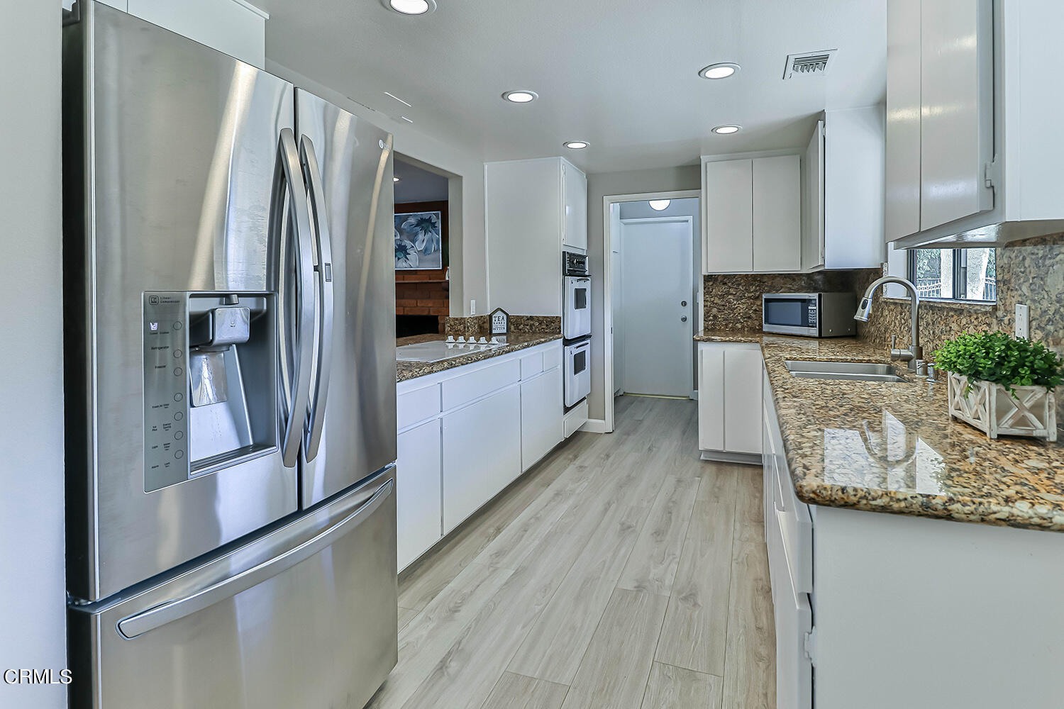 4030 Donlon Road Somis, CA 93066 - Photo 17 of 48 a kitchen with stainless steel appliances granite countertop a refrigerator a stove and a sink