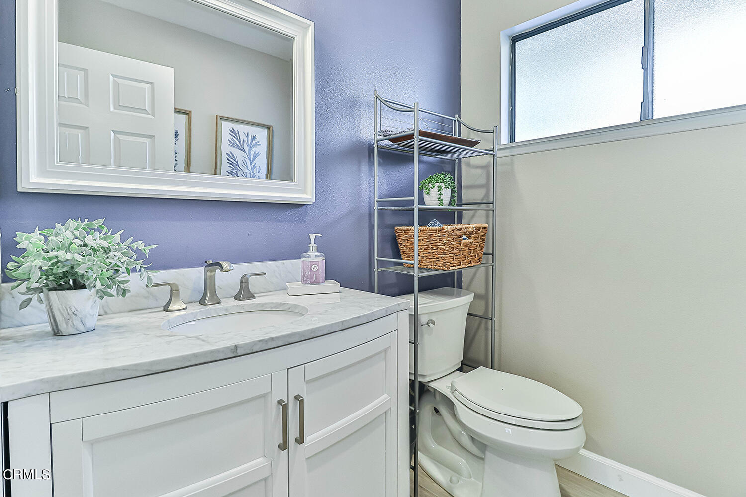 4030 Donlon Road Somis, CA 93066 - Photo 22 of 48 a bathroom with a granite countertop toilet sink and mirror