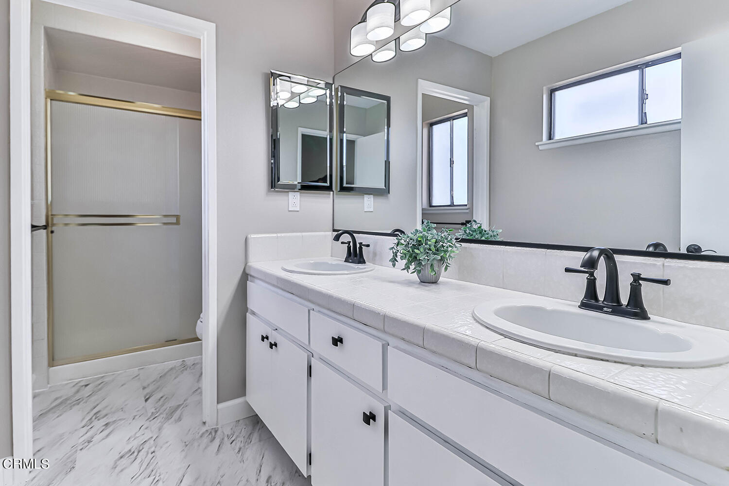 4030 Donlon Road Somis, CA 93066 - Photo 30 of 48 a bathroom with a double vanity sink and a mirror