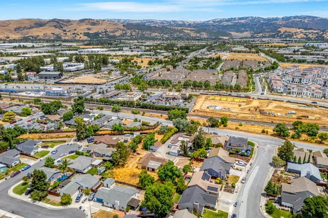 an aerial view of residential houses with outdoor space