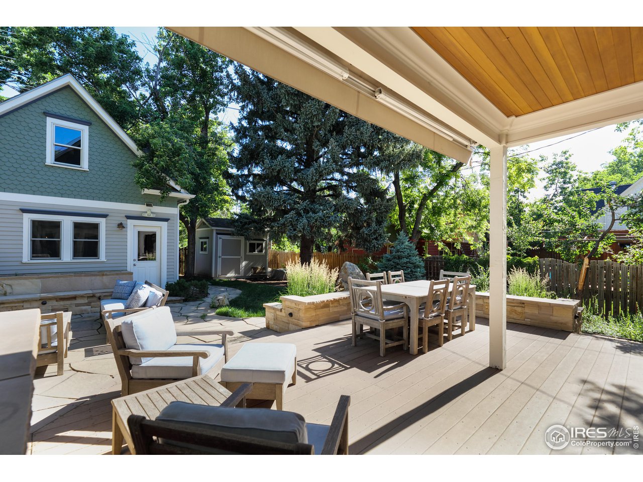 421 Highland Avenue Boulder, CO 80302 - Photo 11 of 39 a view of a patio with couches table and chairs and potted plants