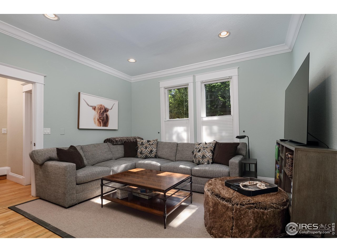 421 Highland Avenue Boulder, CO 80302 - Photo 13 of 39 a living room with furniture and a flat screen tv