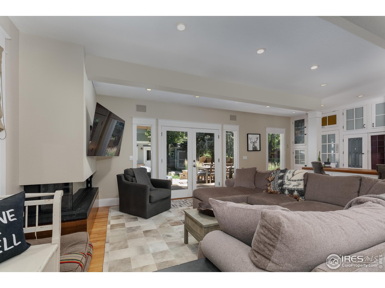 421 Highland Avenue Boulder, CO 80302 - Photo 19 of 39 a living room with furniture large window and flat screen tv
