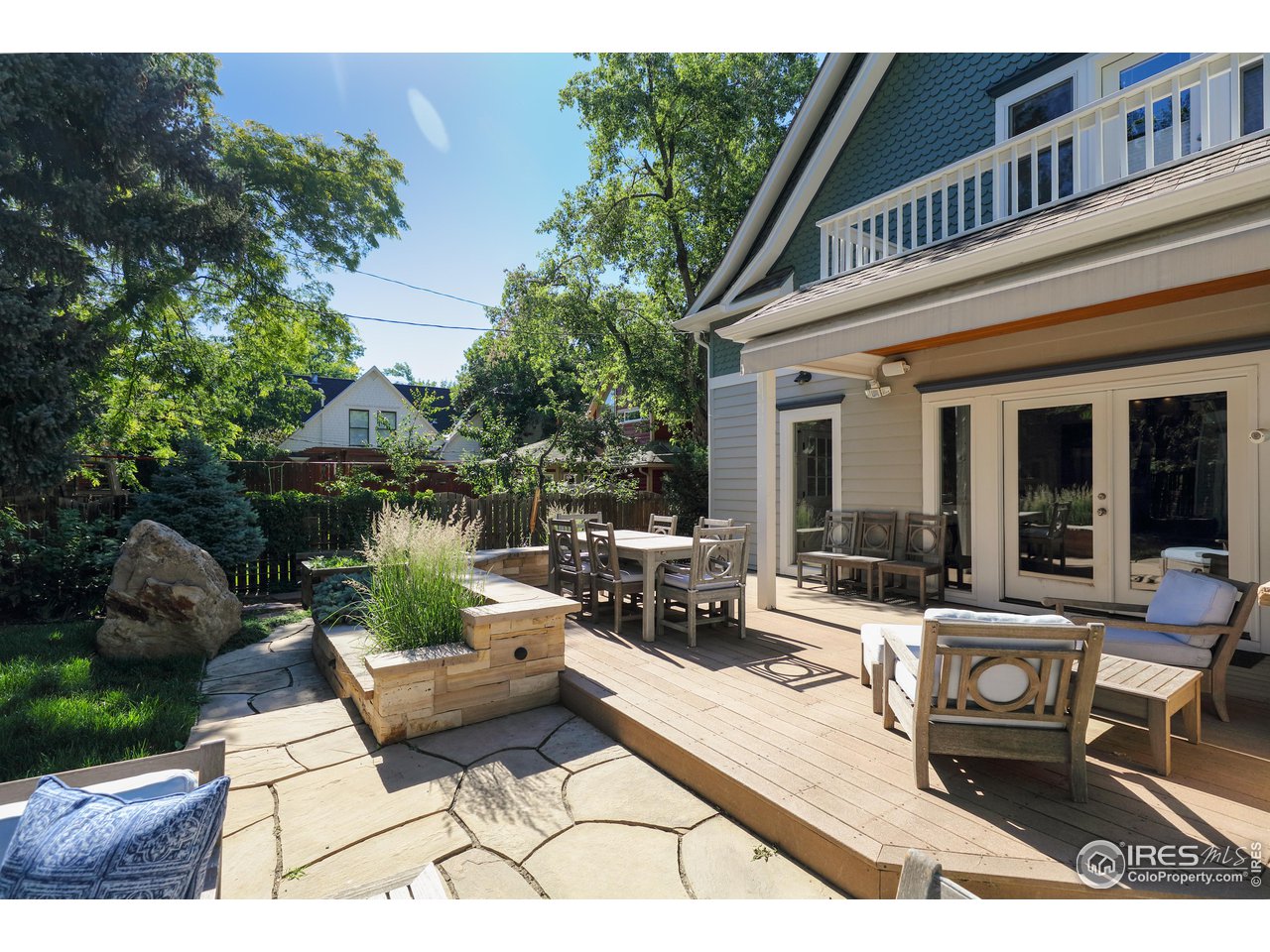 421 Highland Avenue Boulder, CO 80302 - Photo 25 of 39 a view of a patio with couches table and chairs and potted plants