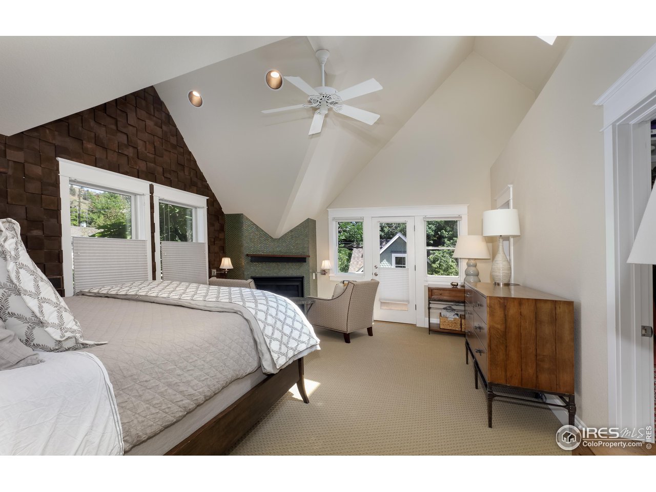 421 Highland Avenue Boulder, CO 80302 - Photo 27 of 39 a bedroom with furniture and a large window