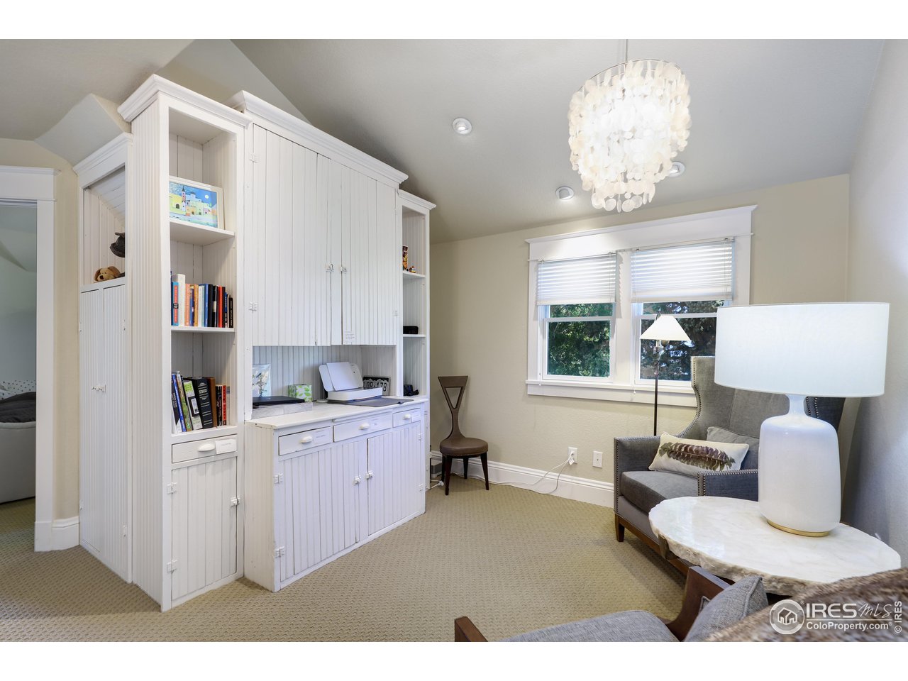 421 Highland Avenue Boulder, CO 80302 - Photo 31 of 39 a kitchen with furniture and a chandelier