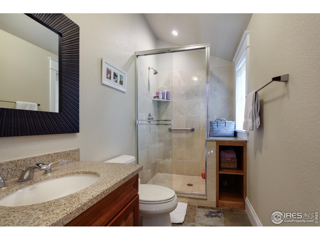 421 Highland Avenue Boulder, CO 80302 - Photo 33 of 39 a bathroom with a granite countertop sink toilet and shower