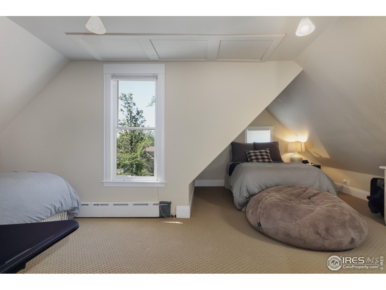 421 Highland Avenue Boulder, CO 80302 - Photo 34 of 39 a bedroom with a bed and a window