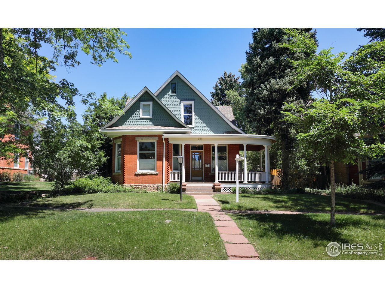 421 Highland Avenue Boulder, CO 80302 - Photo 35 of 39 a front view of a house with a yard