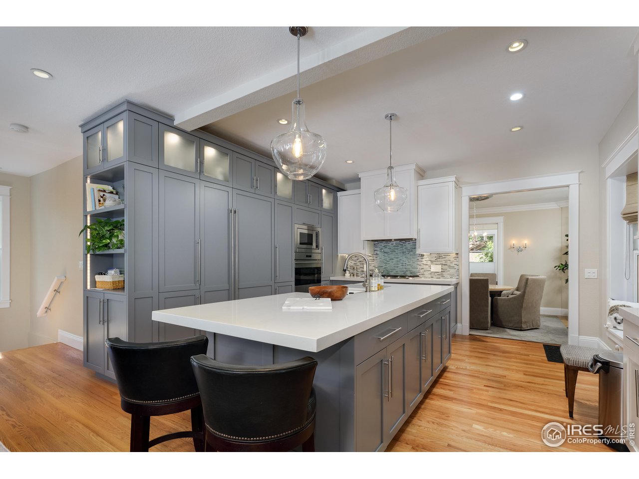 421 Highland Avenue Boulder, CO 80302 - Photo 4 of 39 a large kitchen with a table and chairs