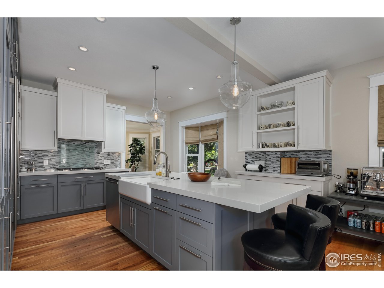421 Highland Avenue Boulder, CO 80302 - Photo 8 of 39 a kitchen with stainless steel appliances granite countertop a stove a sink dishwasher and a microwave oven with white cabinets