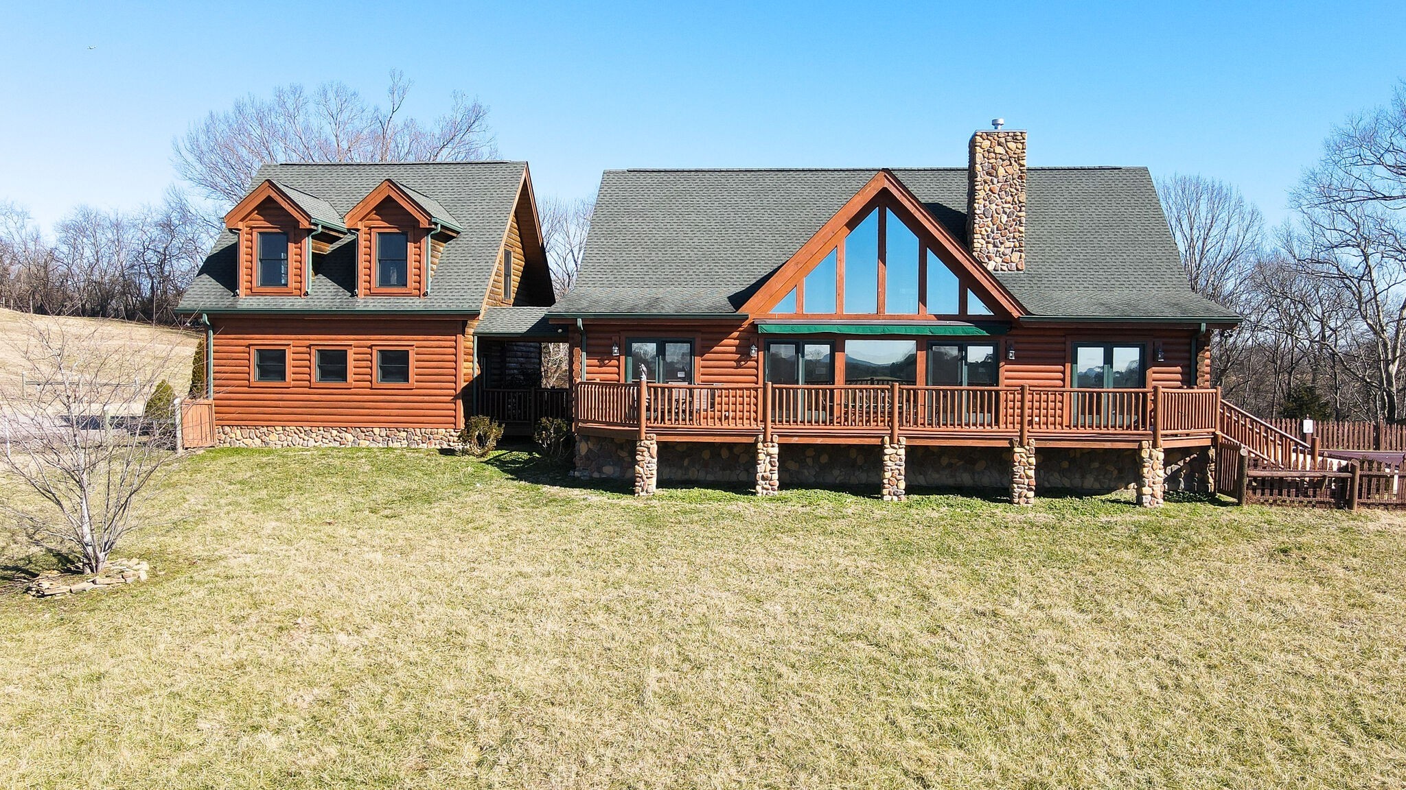 4054 Wilson Pike Franklin, TN 37067 - Photo 5 of 57 a view of a big house with large trees and plants