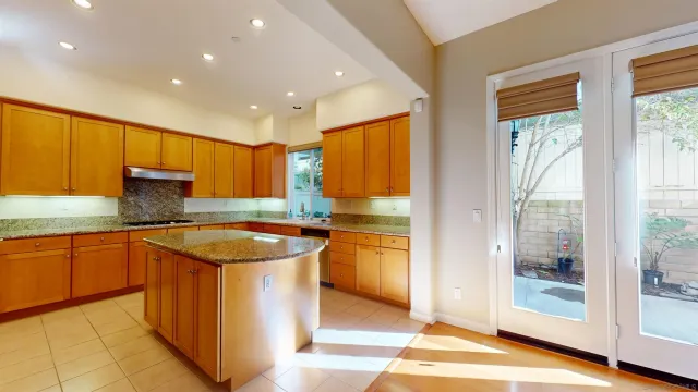 a kitchen with a sink stove and cabinets