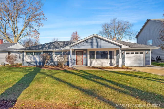 a view of a house with a yard balcony and sitting area