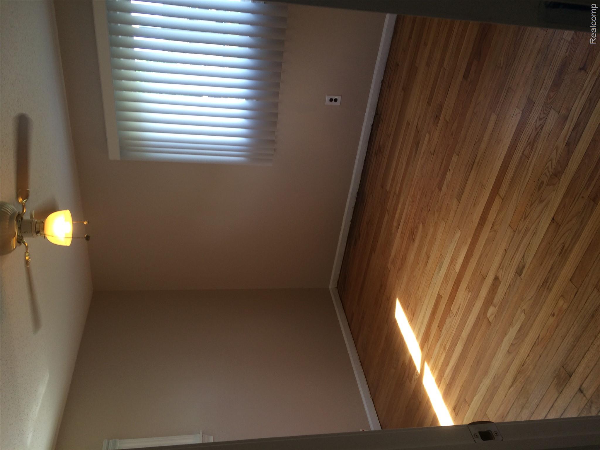 30057 Spring Arbor Drive Inkster, MI 48141 - Photo 8 of 9 Wood-finish flooring with baseboard trim