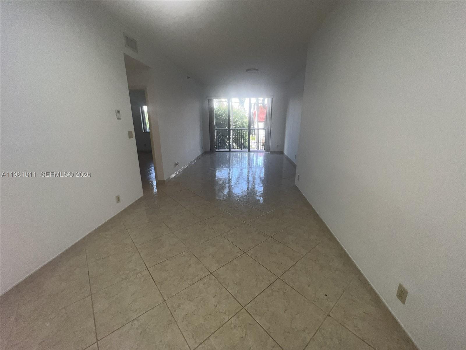 8816 Collins Avenue, Unit 105 Surfside, FL 33154 - Photo 2 of 30 an empty room with windows