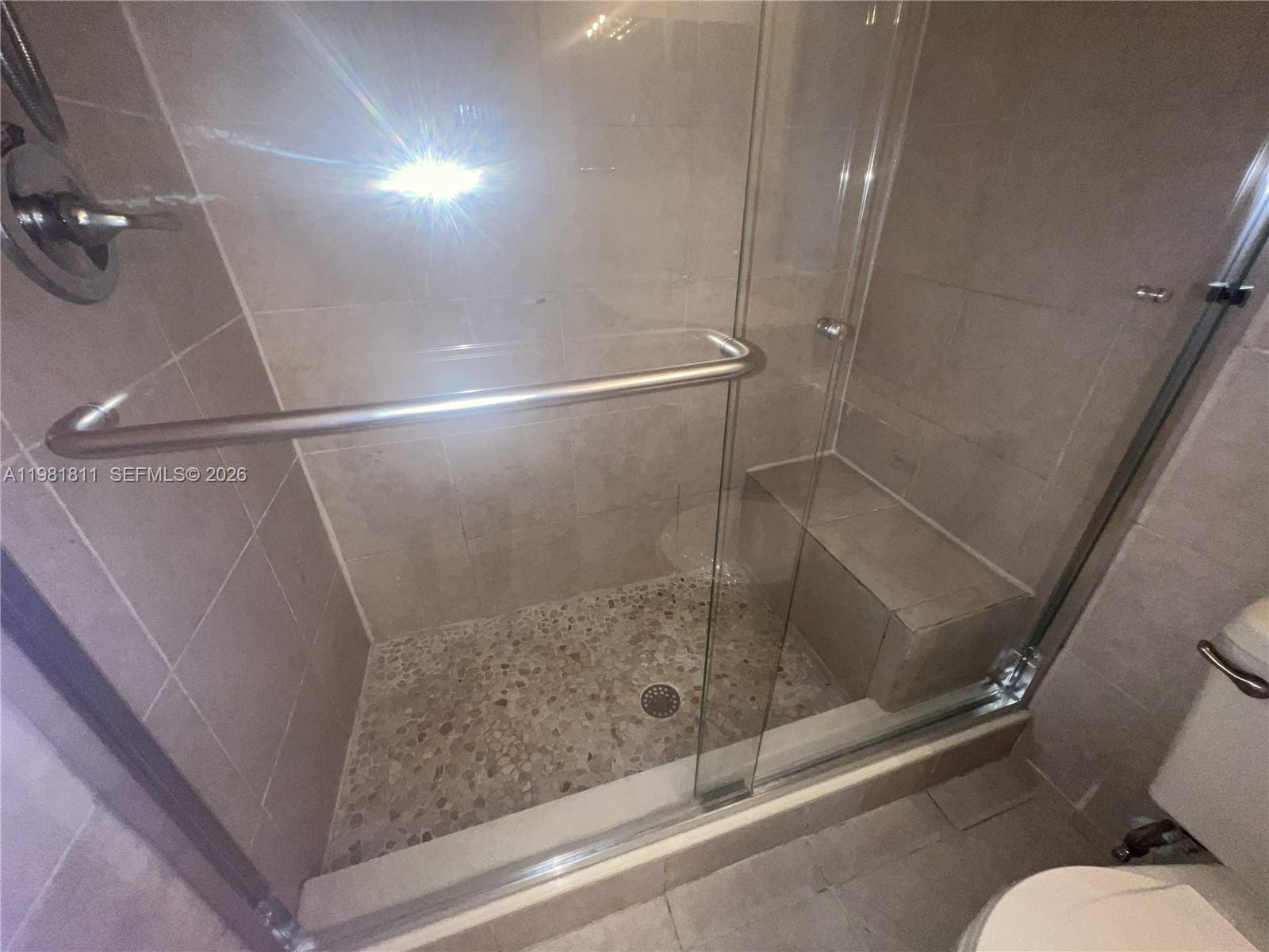 8816 Collins Avenue, Unit 105 Surfside, FL 33154 - Photo 24 of 30 a bathroom with a shower