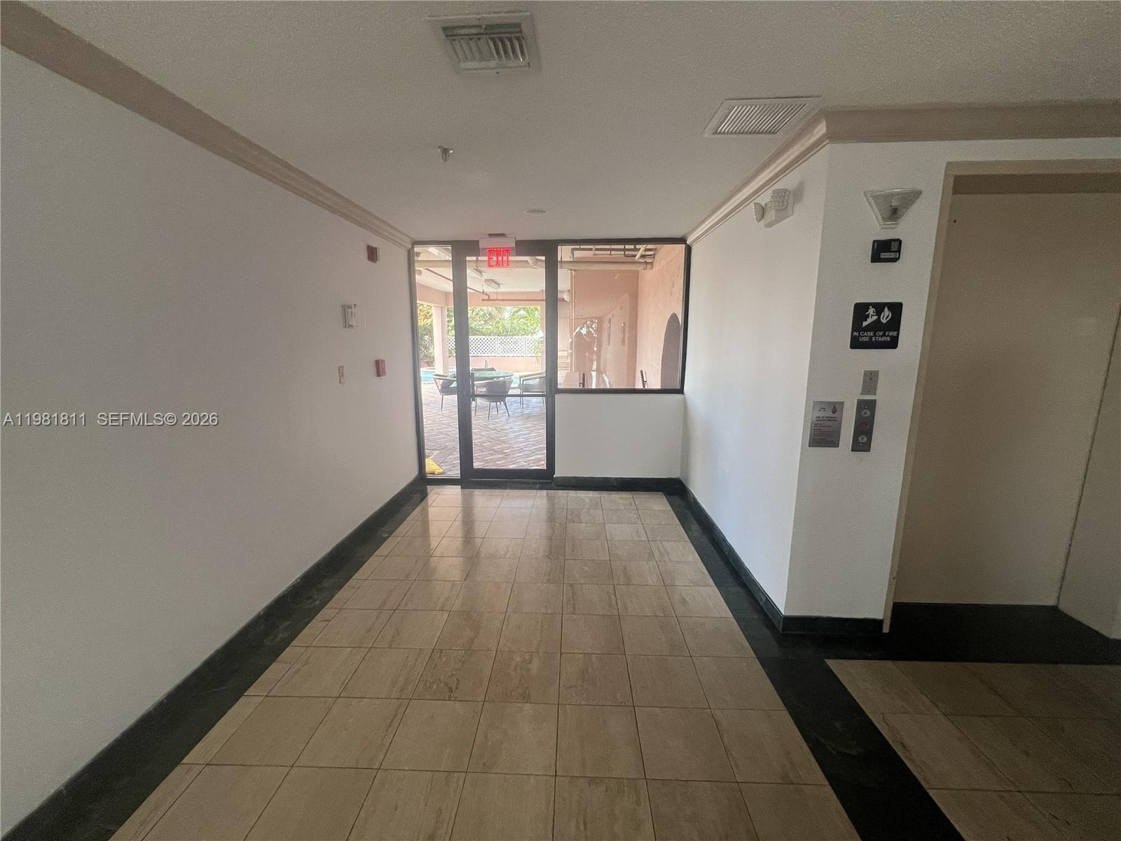 8816 Collins Avenue, Unit 105 Surfside, FL 33154 - Photo 25 of 30 a view of a hallway