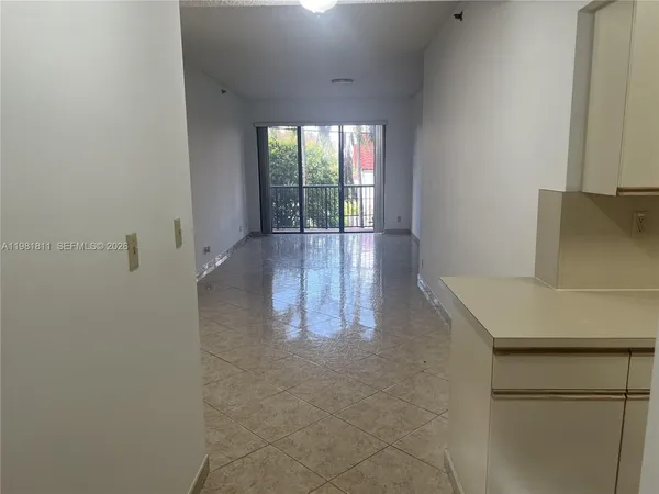 a view of a kitchen with a sink and dishwasher