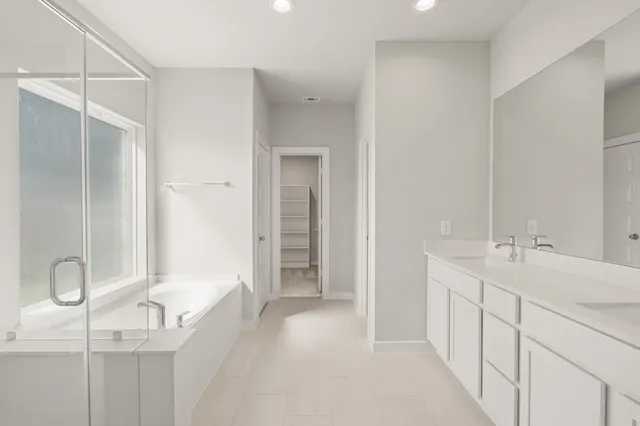 a bathroom with a sink and mirror