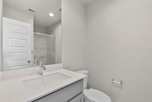 a view of a garden with a lake in the background