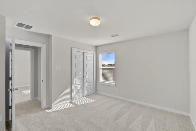 a view of a swimming pool with a table and chairs