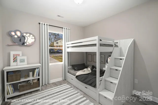 a bedroom with a bed and glass door