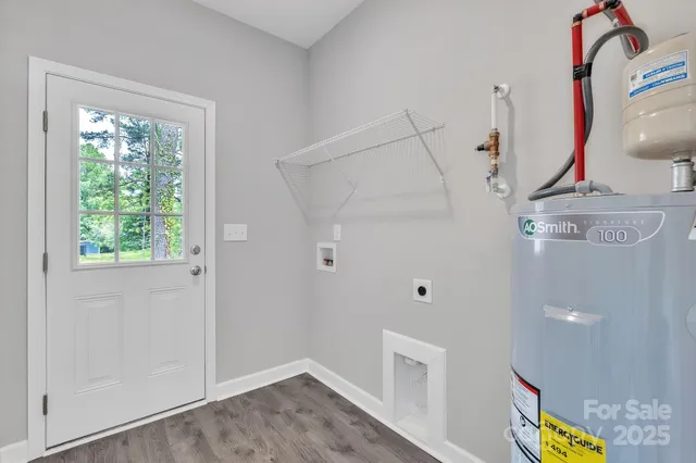 a view of an entryway with wooden floor