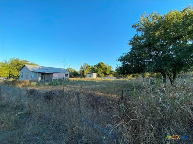 a view of a yard with an outdoor space