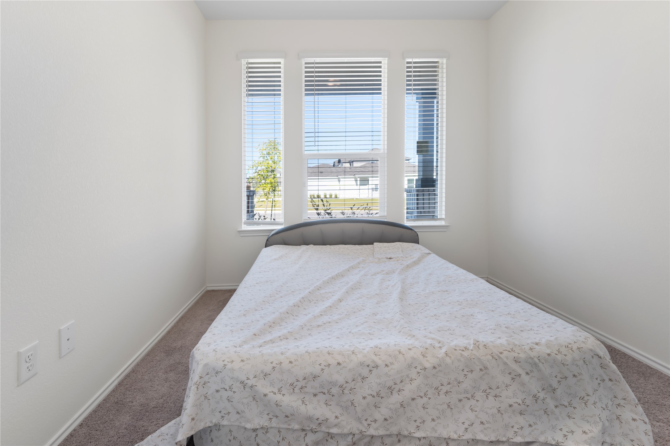 18501 Spotted Eagle Lane Elgin, TX 78621 - Photo 12 of 40 Carpeted bedroom featuring baseboards