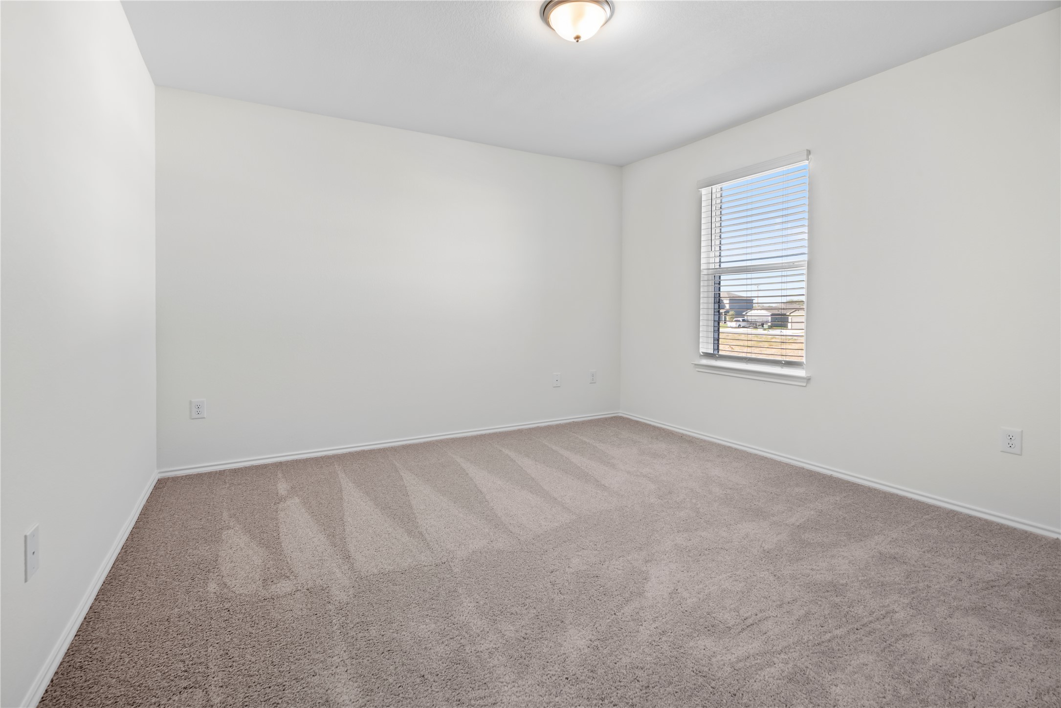 18501 Spotted Eagle Lane Elgin, TX 78621 - Photo 18 of 40 Carpeted empty room with baseboards