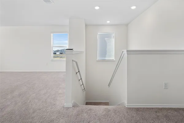 a view of a room with rack and white walls